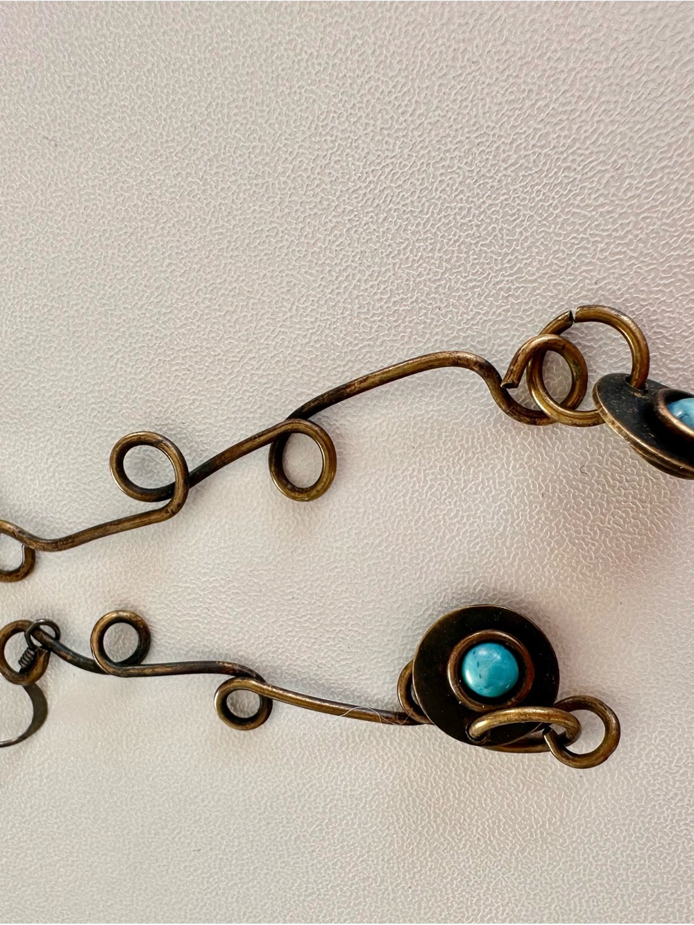 Handcrafted Bronze Swirl Necklace with Turquoise Accent